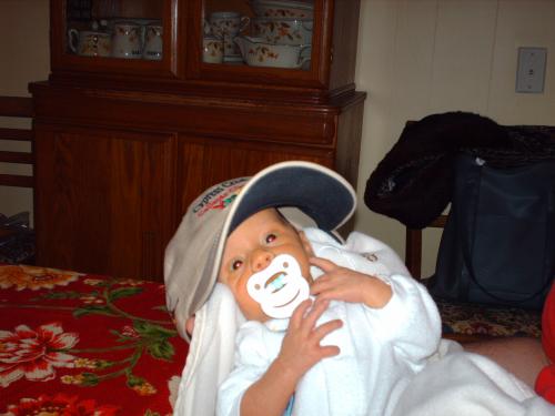 Ty, tryin' dad's hat