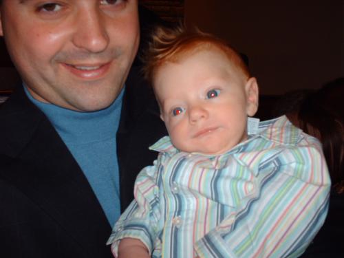 Toren all dressed up and dedicated with Uncle Kev