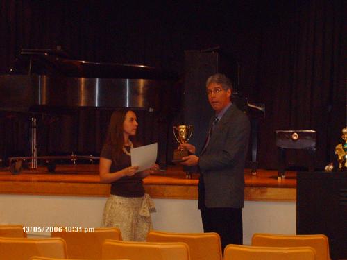 Stephanie receives her zillionth Gold Cup award
