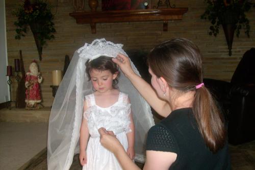 Mom pins the veil